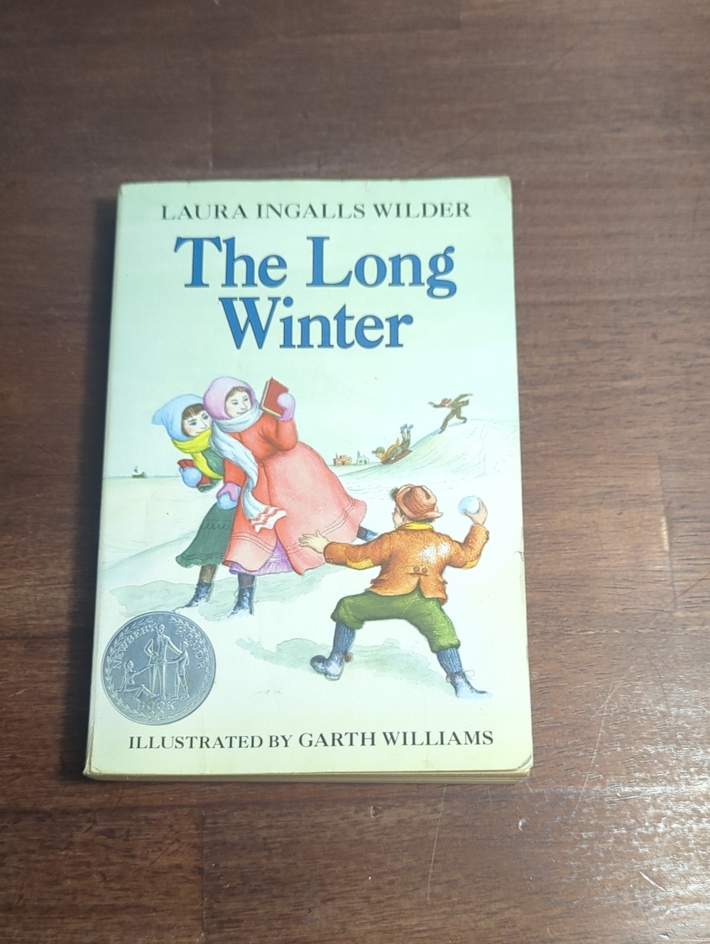 Book cover showing people in winter clothing